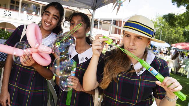 Having fun with bubbles are (from left) Sandilmi Kalubowila, Senudi Sesathpura and Monique Hitchcock at the Fairholme Spring Fair, Saturday, October 19, 2024. Picture: Kevin Farmer