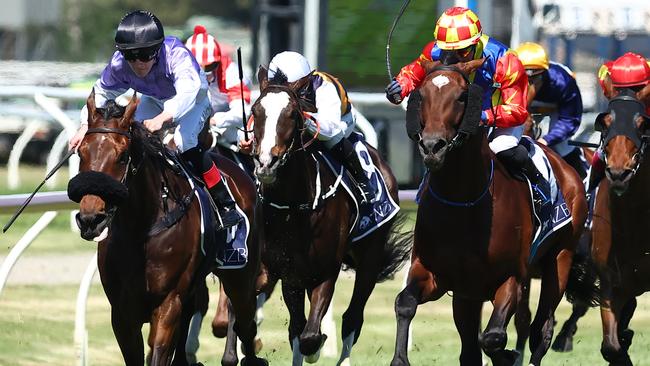 NEWCASTLE, AUSTRALIA - NOVEMBER 18: Zac Lloyd riding Stroke Of Luck wins Race 6 New Zealand Bloodstock The Beauford Handicap  during Sydney Racing ( The Hunter ) at Newcastle Racecourse on November 18, 2023 in Newcastle, Australia. (Photo by Jeremy Ng/Getty Images)