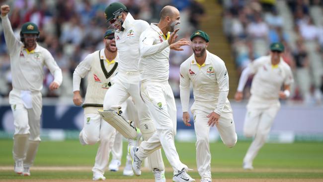 Australia captain Tim Paine celebrates with Nathan Lyon after the pair had combined to dismiss Ben Stokes.