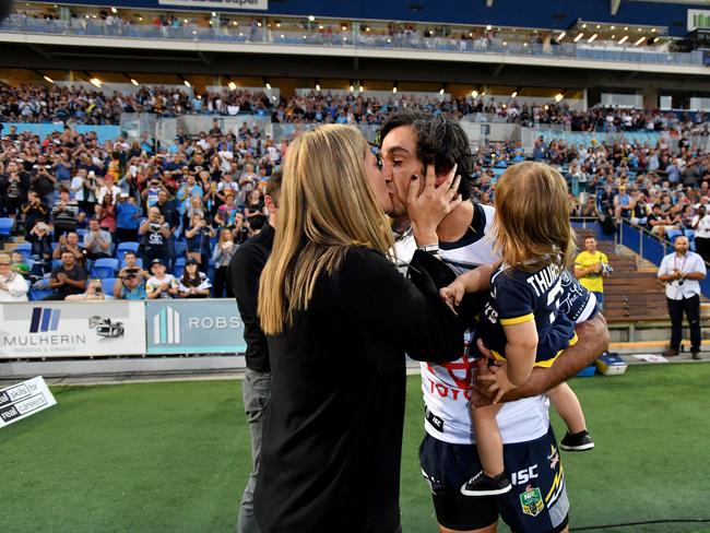 Johnathan Thurston kissing Samantha as he runs onto the field before playing his final NRL game in September this year. Picture: AAP Image/Darren England