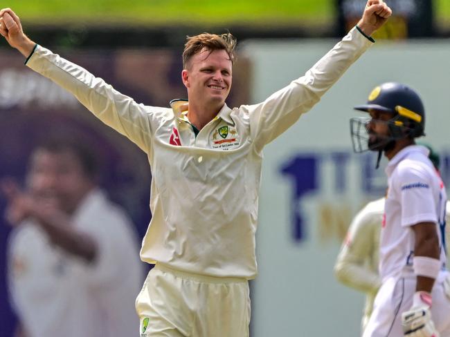 Australia's Matthew Kuhnemann celebrates after taking the wicket of Sri Lanka's captain Dhananjaya de Silva during the third day of the first Test cricket match between Sri Lanka and Australia at the Galle International Cricket Stadium in Galle on January 31, 2025. (Photo by Ishara S. KODIKARA / AFP)