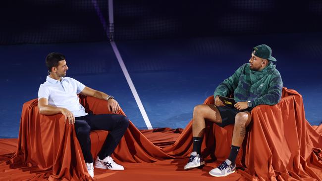 Djokovic is interviewed by Kyrgios at Melbourne Park on Friday. Picture: Getty