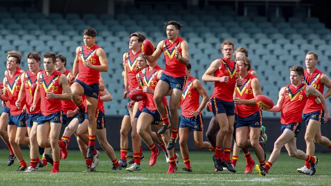 South Australia’s team warms up ahead of its clash with Vic Country in the AFL under-18 championships on June 17. Picture: AAP Image/Russell Millard