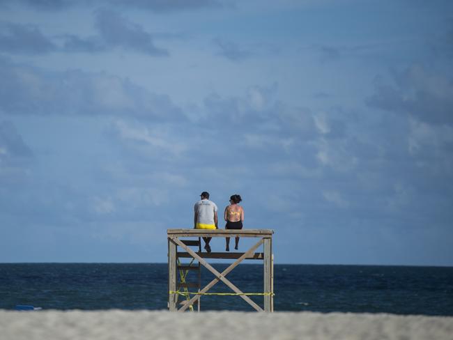 Two people look out at the ocean days before the arrival of Hurricane Florence. Picture: AFP