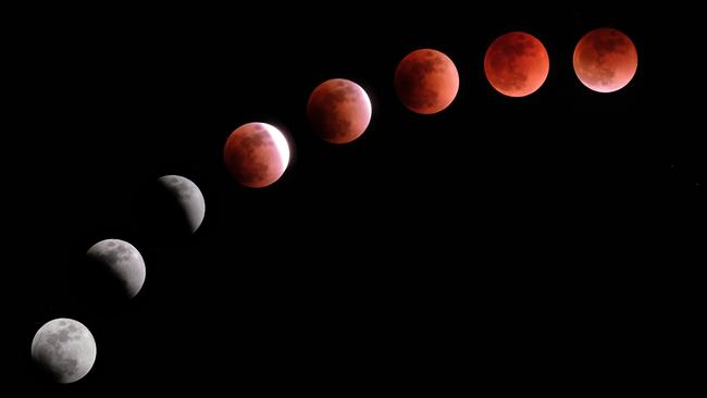 This composite image shows the moon during a lunar eclipse referred to as the ‘super blue blood moon’. Picture: AFP