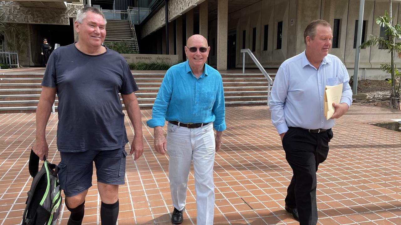 Mark Fishburn, Tony Green, and Alan Sheret leave the Townsville Courthouse after appearing in the Planning and Environment Court.