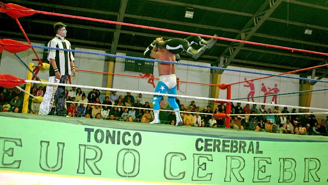 Danger money ... La Paz locals lap up a typical Bolivian bash. No fire ball required this time. Picture: Andrew Carswell