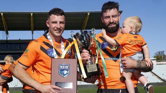 Player of the match Cameron Williams with captain-coach Christian Nahlous and his son Coah. Picture: John Appleyard