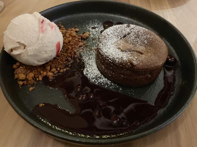 Dark choc fondant with cinnamon ice cream at the Feathers Greenhouse. Picture: Dianne Mattsson