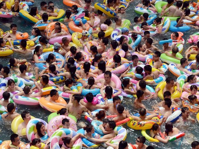 SUINING, CHINA - JULY 11: (CHINA OUT) Visitors crowd at Chinese Sea of Death tourist resort in Daying County to escape high temperature on July 11, 2015 in Suining, Sichuan Province of China. Most parts in China ushered in hot weather in July and more than eight thousand visitors from every corner of China crowded to China Sea f Death to enjoy the cool. (Photo by ChinaFotoPress/Getty Images)