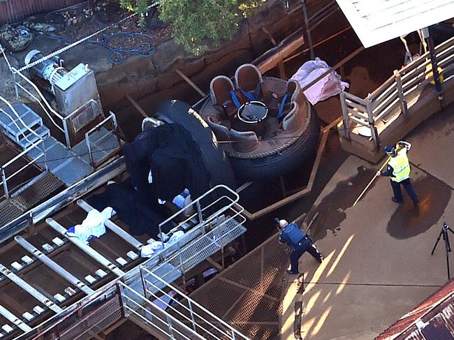 Queensland Emergency service personnel are seen at amusement theme park Dreamworld on the Gold Coast, Queensland, Tuesday, Oct. 25, 2016. Four people have died after an accident on a ride at Dreamworld. The victims became trapped on a conveyor belt at the theme park after a raft they were in flipped on the Thunder River Rapids ride on Tuesday afternoon. (AAP Image/Dan Peled)