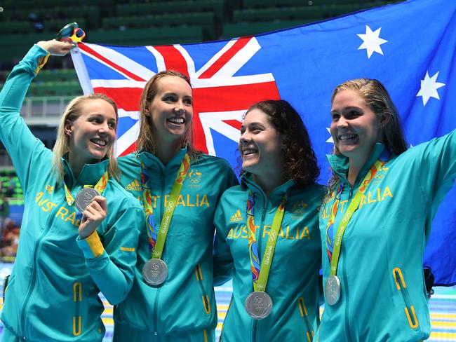 RIO DE JANEIRO, BRAZIL - AUGUST 10: Silver medalists Leah Neale, Emma McKeon, Bronte Barratt and Tamsin Cook of Australia pose during the medal ceremony for the Women's 4 x 200m Freestyle Relay Final on Day 5 of the Rio 2016 Olympic Games at the Olympic Aquatics Stadium on August 10, 2016 in Rio de Janeiro, Brazil. (Photo by Tom Pennington/Getty Images)