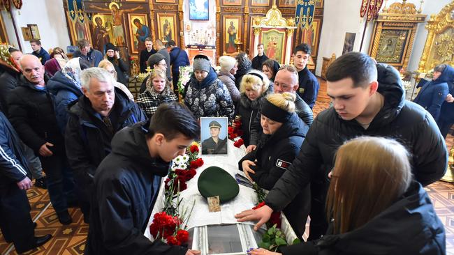 Mourners attend the funeral service for 20 year-old Russian serviceman Nikita Avrov. Picture: AFP