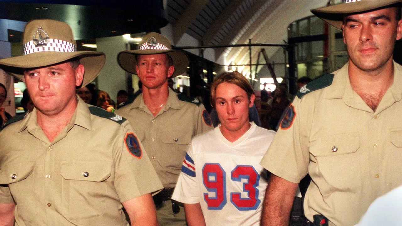 Ben William McLean (18) escorted by heavy police guard arrives at Darwin Airport. McLean and Phu Ngoc Trinh, (18) are charged with the drowning murders Thai sex workers, Phuangsri Kroksamrang (58) and Somjai Insamnan (27) whose bodies were found on 03 Mar 2004. The women had their legs bound before being thrown into the Adelaide River in while still alive. Picture: Michael/Marschall