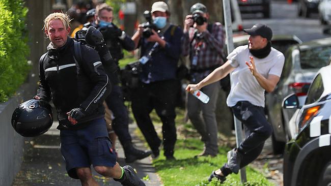 Protesters quickly fled Elwood Beach. Picture: Alex Coppel.