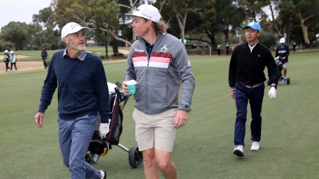 Advertiser competition winner Pieter de Wit teamed up with pro golfer Cameron Smith for nine holes. Picture: Dean Martin