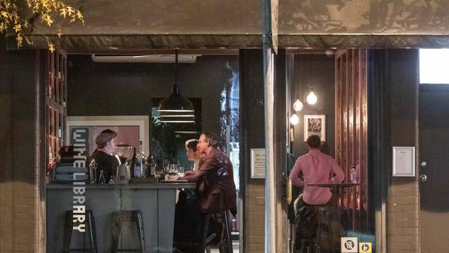 Patrons take a drink at the Wine Library on Oxford Street, Paddington last night. Picture: Gordon McComiskie