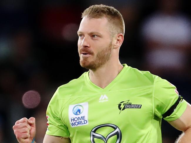 CANBERRA, AUSTRALIA - DECEMBER 14: Nathan McAndrew of the Thunder celebrates after claiming the wicket of Tom Cooper of the Heat during the Big Bash League match between the Sydney Thunder and the Brisbane Heat at Manuka Oval, on December 14, 2020, in Canberra, Australia. (Photo by Brendon Thorne/Getty Images)