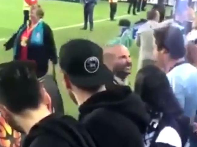 George Calombaris confronts a fan during the A-League grand final.