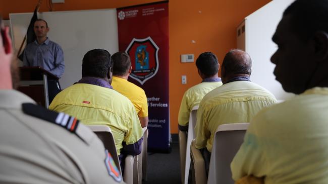 Low security prisoners attend the announcement of a $1.7 per-year training partnership between Charles Darwin University and NT Corrections.