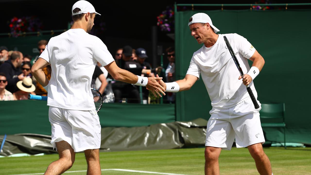 Lleyton Hewitt (R) and Jordan Thompson in action at Wimbledon in 2016.