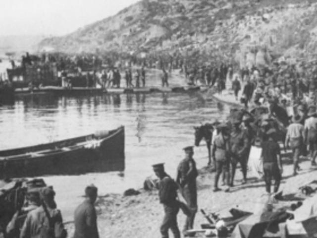 Troops, supplies and tents along the beach at Anzac Cove not long after the landing. Pic: Courtesy AWM A03092