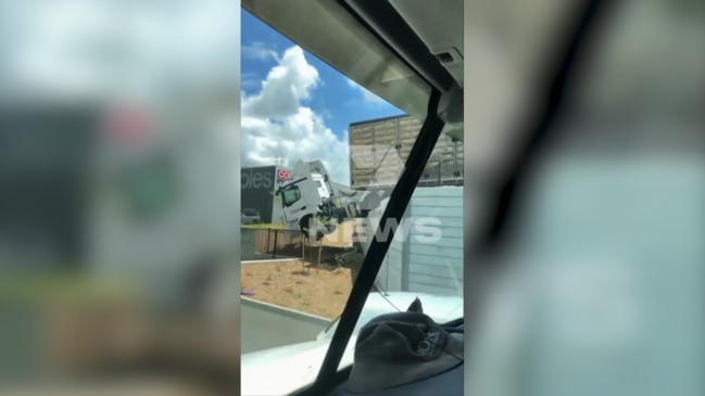 Chicken mayhem as truck launches over Bunnings fence (7NEWS)