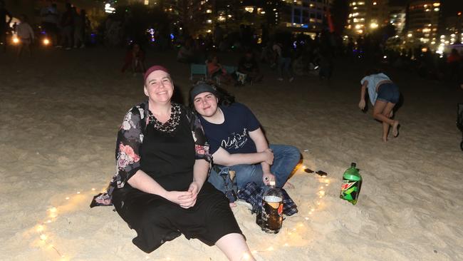 A family watching fireworks on New Year’s Eve. Picture: Mike Batterham