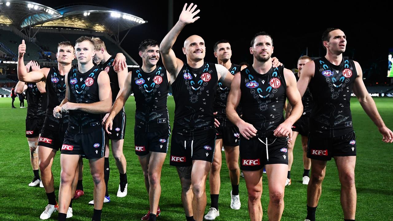 Sam Powell-Pepper waves as Boak leads off a happy Power team. Picture: Getty Images