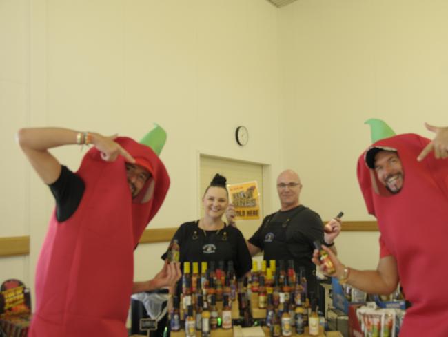 (From left) Chilli Carnival digital marketing manager Marco Sagona, Tania and Troy Simpson from Captain's Candy, and event co-director, Jason O'Connor showing off the awesome products available at Murphys Creek Chilli Carnival. Picture: Isabella Pesch