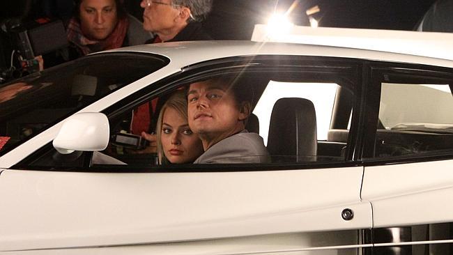 Leonardo DiCaprio and Aussie actor Margot Robbie pictured filming a scene on the set of "The Wolf of Wall Street" in Brooklyn.