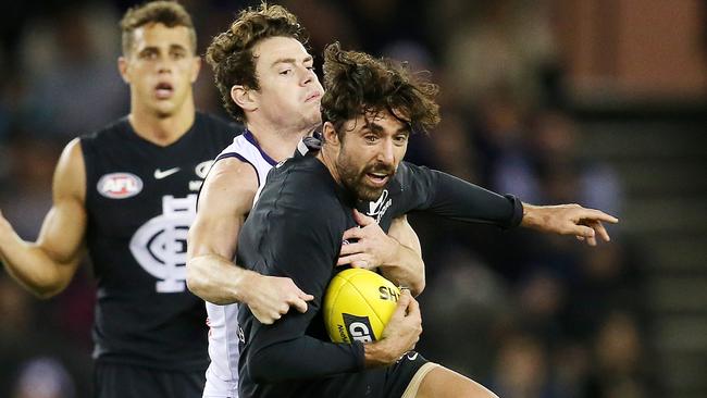 Carlton’s Kade Simpson tries to break out of the tackle of Fremantle's Lachie Neale. Picture: Michael Klein