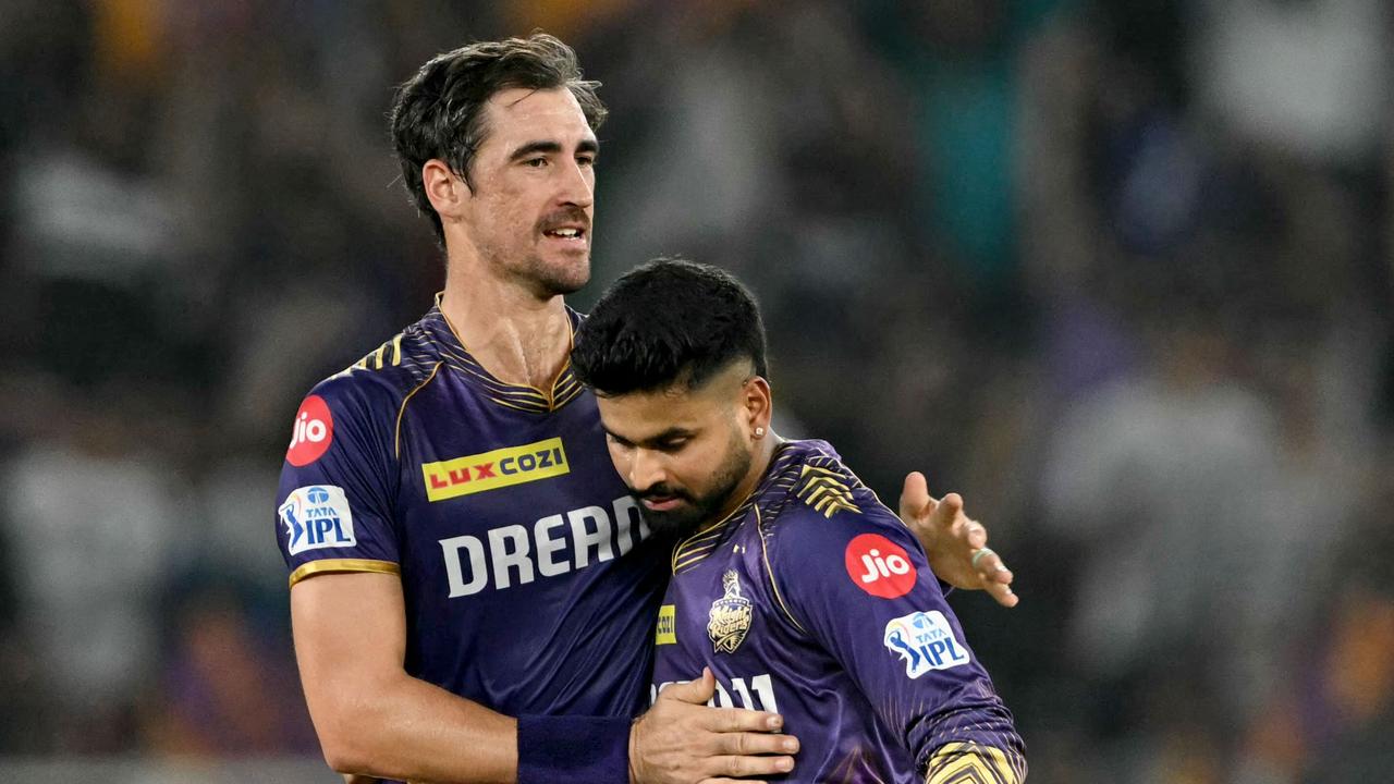 Starc hugs Iyer after taking a wicket last season. Photo by Punit PARANJPE / AFP