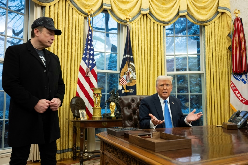 Elon Musk listens as US President Donald Trump speaks in the Oval Office of the White House