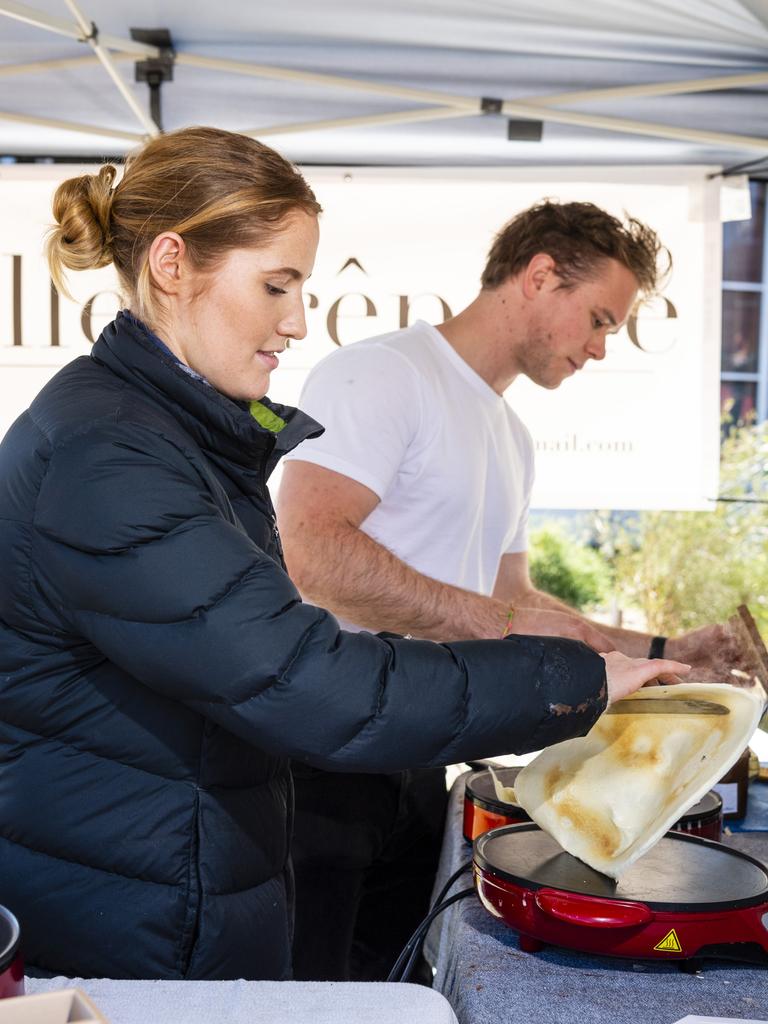 Emily Scott and Dean Baxendale prepare their La Belle Creperie crepes at the Toowoomba Farmers Market, Saturday, July 16, 2022. Picture: Kevin Farmer