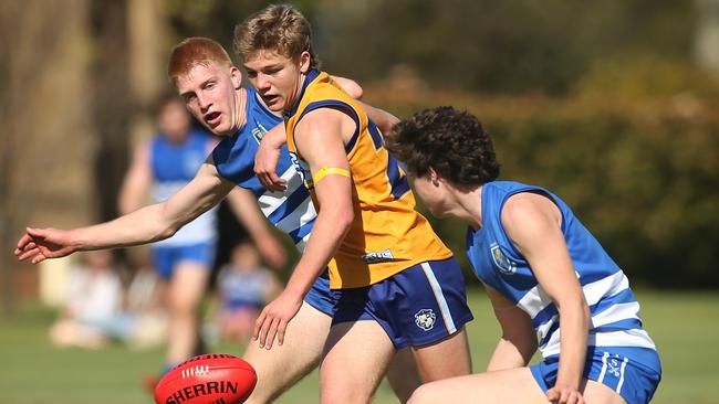 Sacred Heart’s Adam Bunworth gets caught between St Peter's Matthew Roberts and Nic Michaels. 5 September 2020. Picture Dean Martin