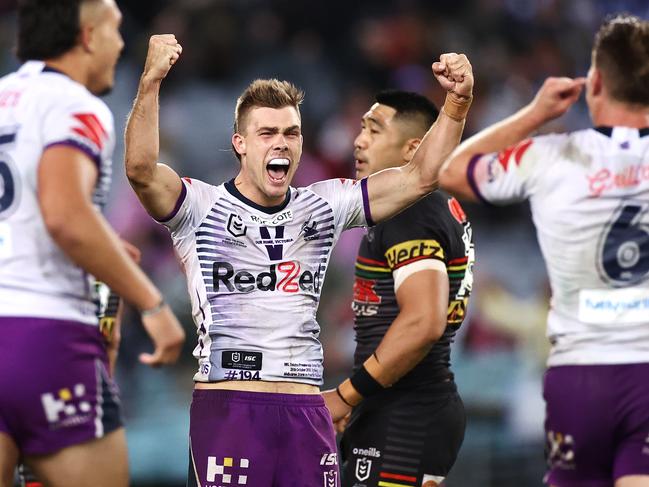 SYDNEY, AUSTRALIA - OCTOBER 25: Ryan Papenhuyzen of the Storm and Cameron Munster of the Storm celebrate winning the 2020 NRL Grand Final match between the Penrith Panthers and the Melbourne Storm at ANZ Stadium on October 25, 2020 in Sydney, Australia. (Photo by Cameron Spencer/Getty Images)