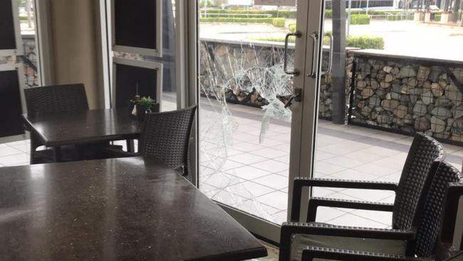 The door was smashed at Coffee Central on 7th, Urraween. Photo: Facebook, Coffee Central on 7th.