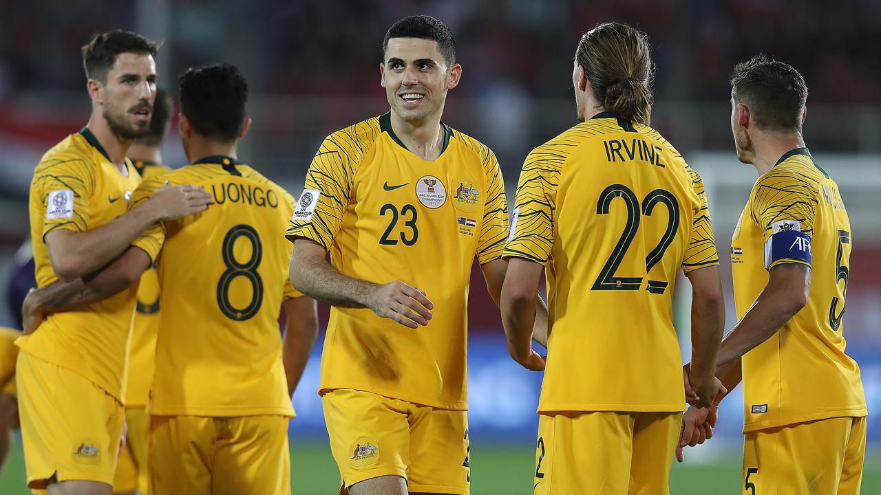 Tom Rogic (C) celebrates his sides second goal with Jackson Irvine and Mark Milligan