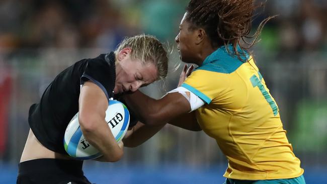 Ellia Green of Australia tackles Kayla Mcalister of New Zealand during the Women's Gold Medal Rugby Sevens match. Picture: Alexander Hassenstein/Getty Images