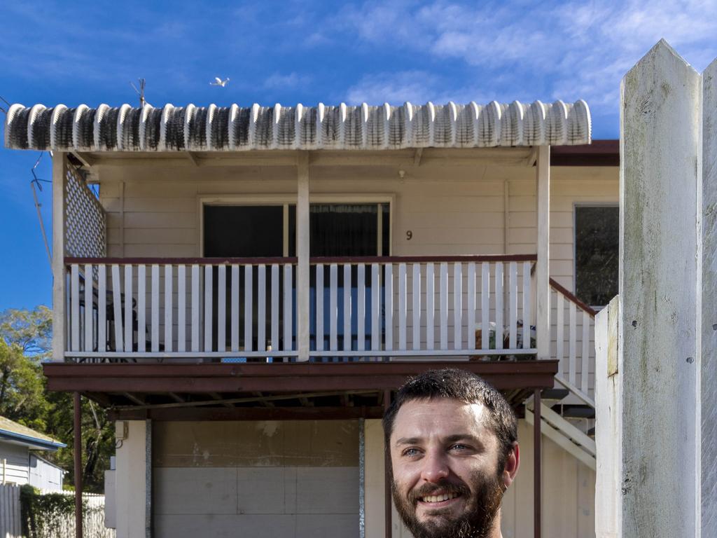 Alexander Hughes (29) at his rental property on Corella Street, Rocklea. He says it has been ‘Ë&#156;eerily quiet’ since the February floods. Picture : Matthew Poon.