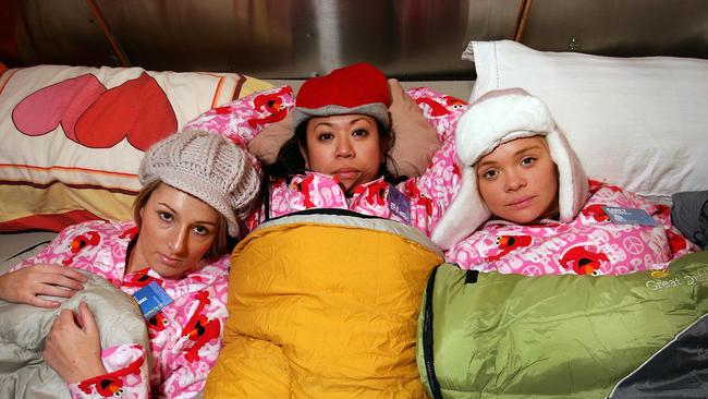 SYDNEY, AUSTRALIA - JUNE 17: Kylee Van Der Torre, Yza Canja and Carly Crutchfield of CCORP, lay in bed during the Vinnies CEO Sleepout at Luna Park on June 17, 2010 in Sydney, Australia. Chief executives and business leaders across the country will tonight give up the comfort of their own beds and experience homelessness for one night to raise funds for St Vincent de Paul Society's homeless services. (Photo by Lisa Maree Williams/Getty Images)