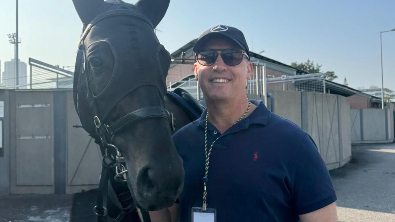 Brisbane trainer Tony Gollan with his Group 1 Hong Kong Mile Hope Antino at the Sha Tin quarantine stables.