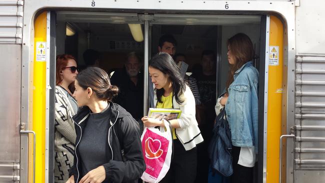 Crowded, standing-room-only trains, like this one at Macdonaldtown are one symbol of how Australia’s infrastructure is not keeping up with its immigration.