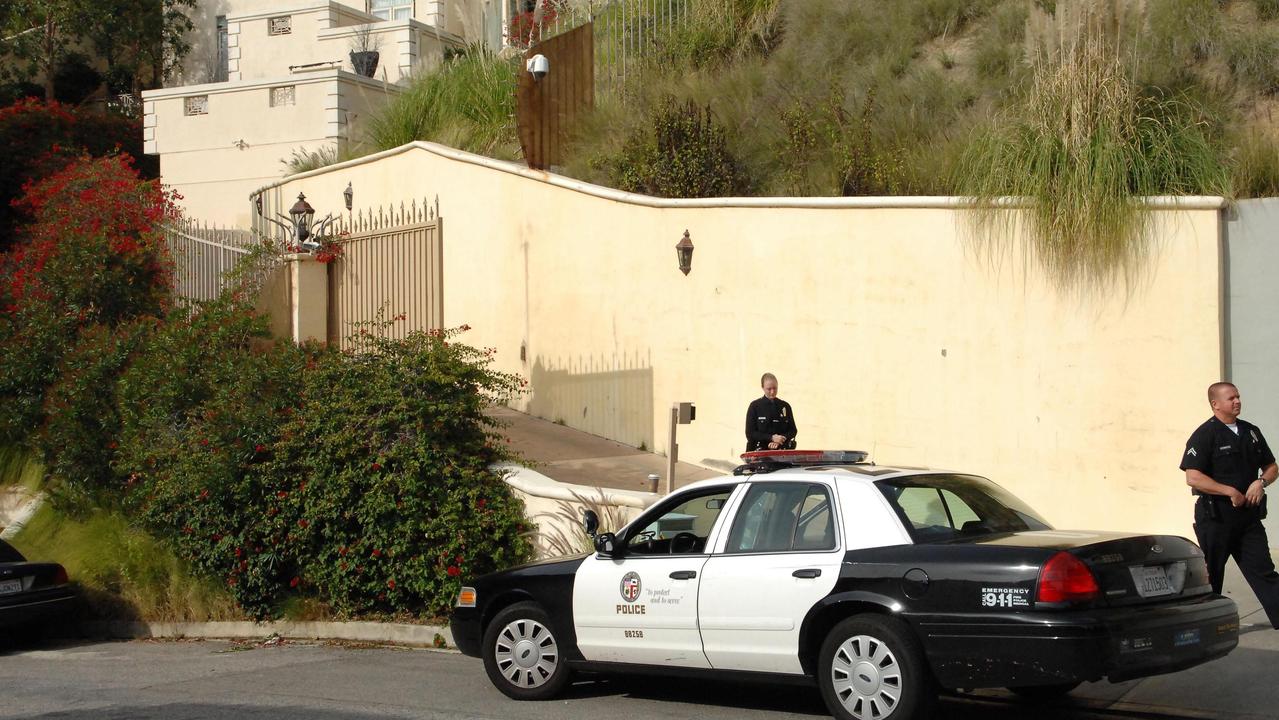 Police outside the home after Murphy’s death. Picture: Splash News/Media Mode