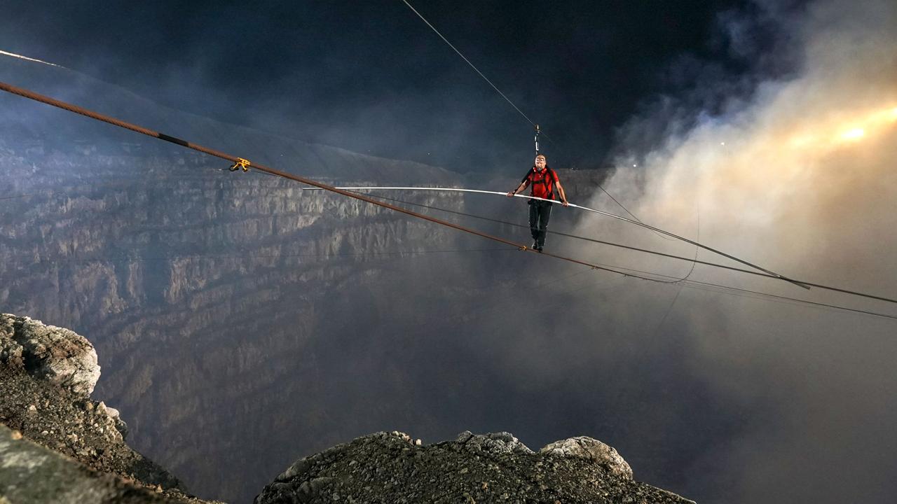 Nik Wallenda was attached to a safety harness and wore protective goggles for the walk. Picture: Jeff Daly / ABC /AFP