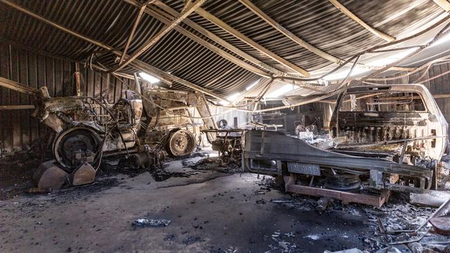 Aftermath: Skeletal farm machinery shows the force of the bushfire that burnt through more than 7000 hectares and destroyed multiple homes. Picture: Tony McDonough