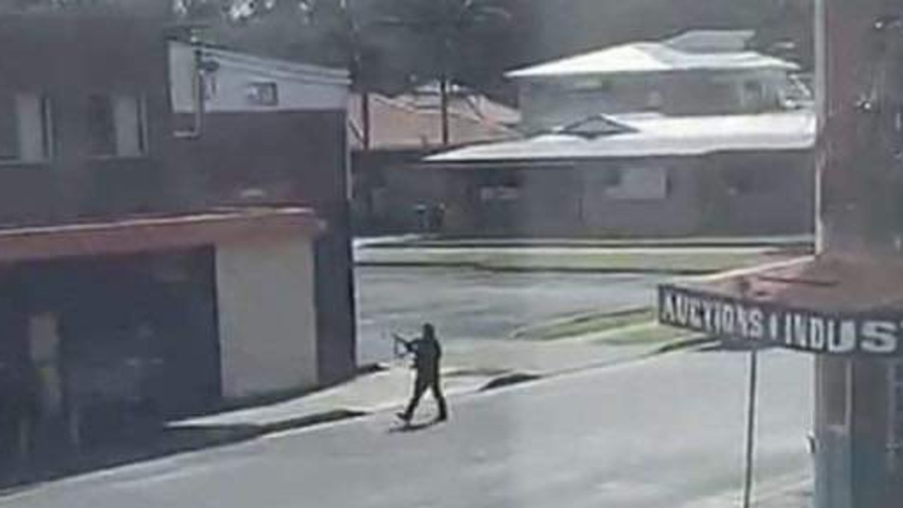 Simon Fleming walked up and down the main street of Windang, dressed in black, firing into the air. Picture: Supplied.