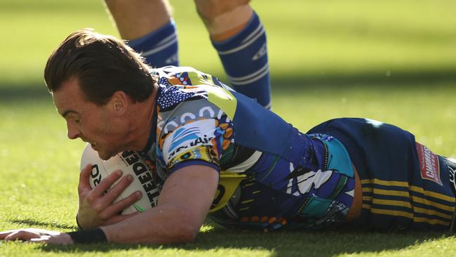 Clint Gutherson of the Eels scores a try during the round 12 NRL match between the Canterbury Bulldogs and the Parramatta Eels at ANZ Stadium.