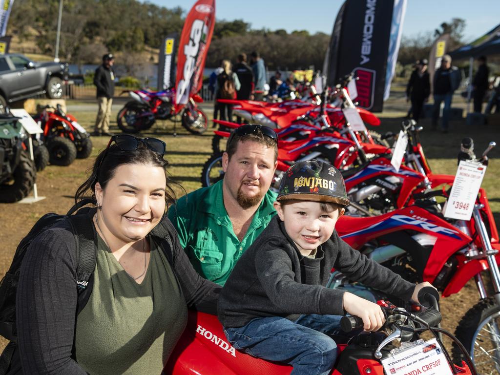 Checking out the motorbikes on show are (from left) Robyn, Kyle and James Fulton at the Queensland Outdoor Adventure Expo at the Toowoomba Showgrounds, Saturday, July 30, 2022. Picture: Kevin Farmer